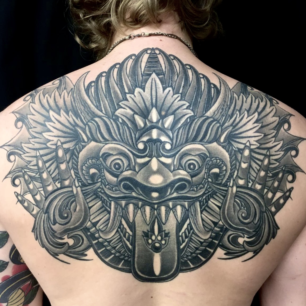 Traditional Balinese barong mask black and grey gray tattoo by ricks custom tattooing Ricardo Pedro at Nexus Collective