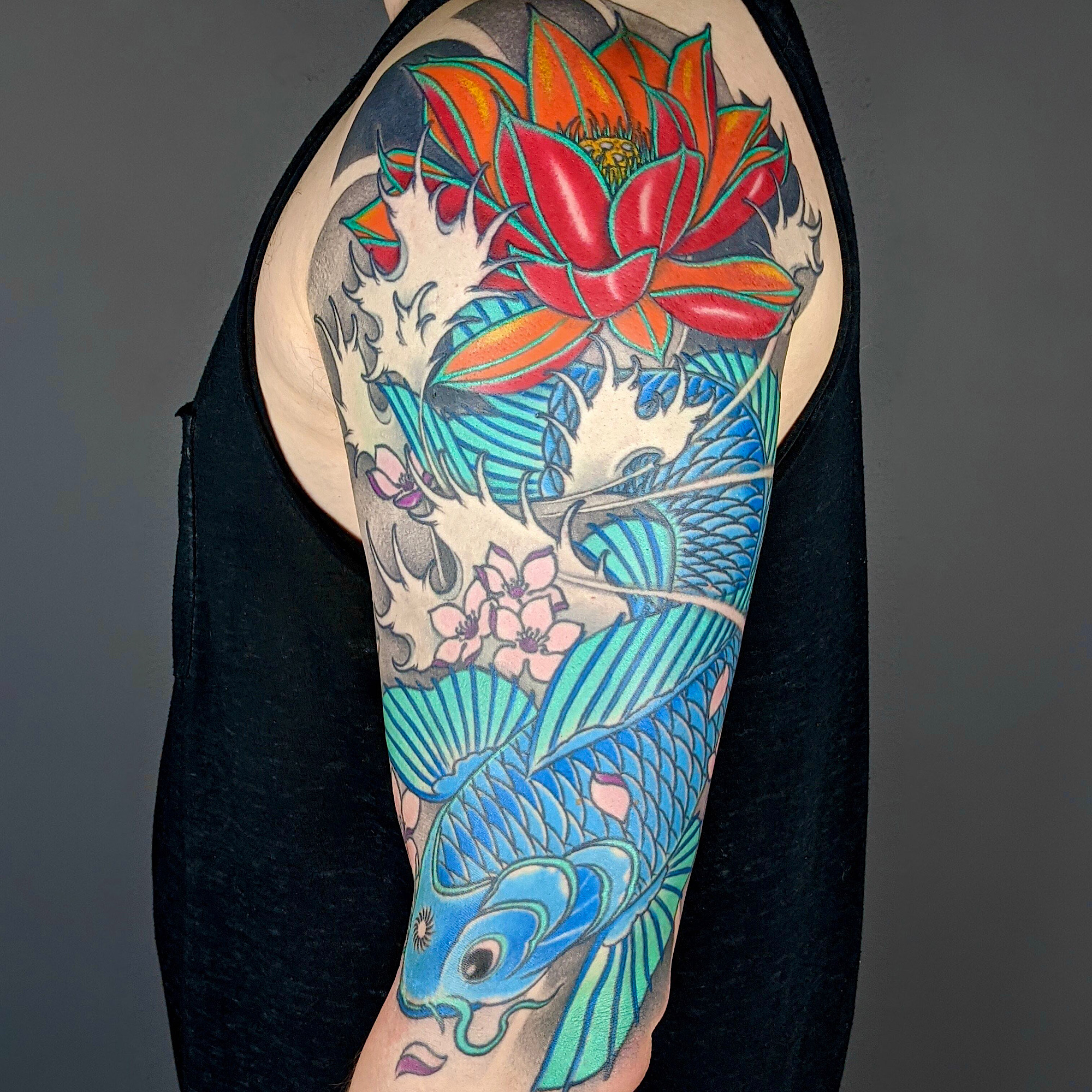 neo japanese irezumi tattoo koi carp fish lotus flower cherry blossoms water nishikigoi tattoo by Ricks custom tattooing Ricardo Pedro at Nexus Collective