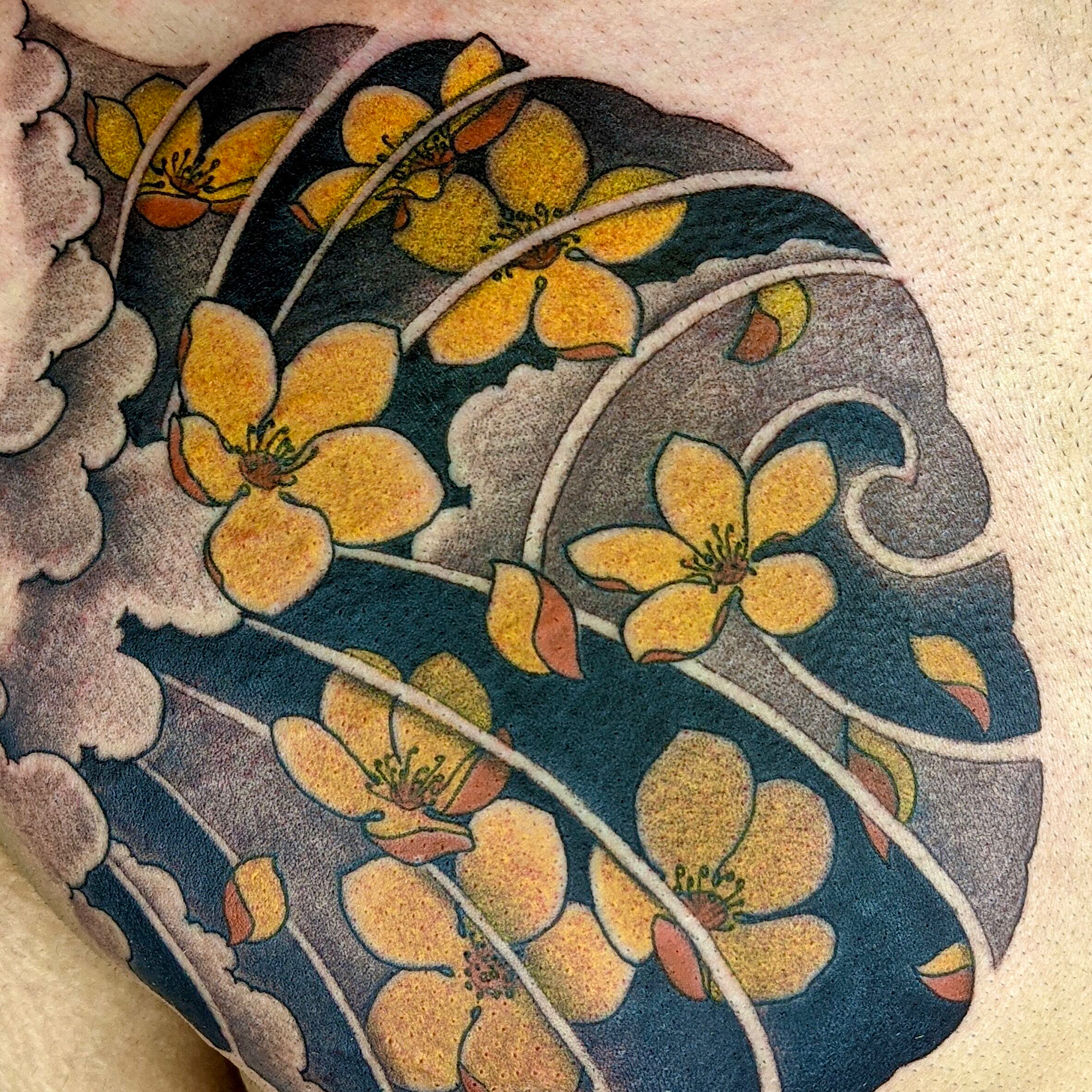 Irezumi neo traditional Japanese oriental tattoo in colour of cherry blossoms and wind bars chest plate by Ricks custom tattooing Ricardo Pedro at Nexus Collective