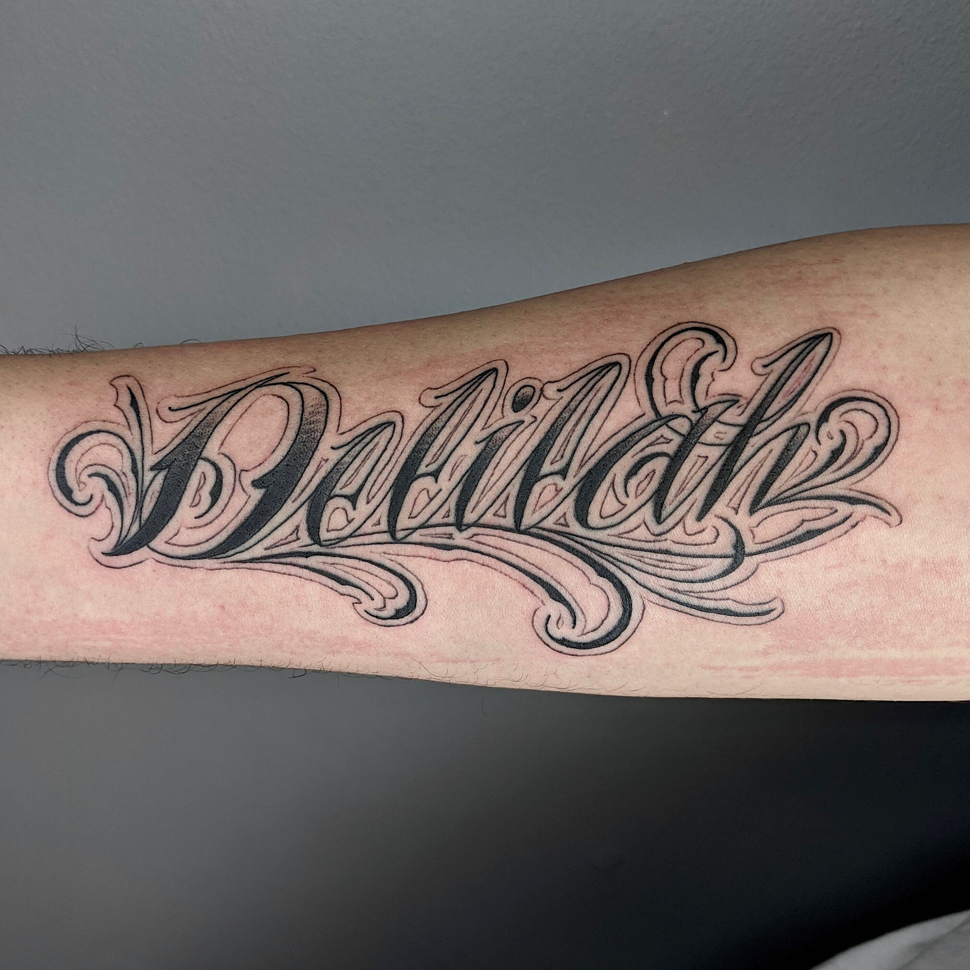 script manuscript lettering on arm love letters black and grey gray lettering tattoo by Ricks custom tattooing Ricardo Pedro at Nexus Collective