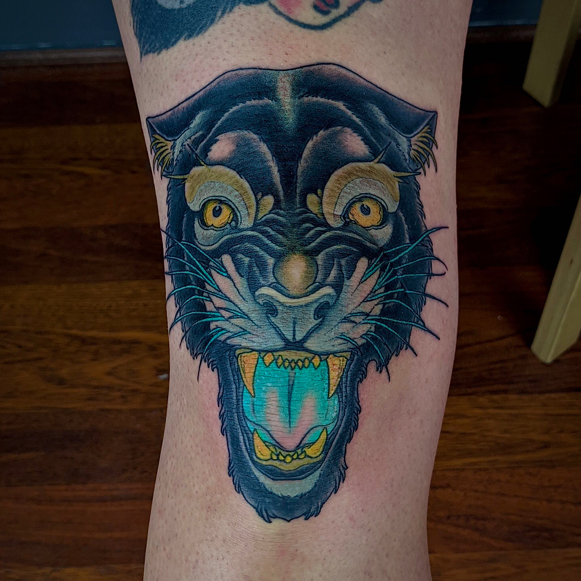 Knee tattoo neo traditional black Panther by ricks custom tattooing Ricardo Pedro