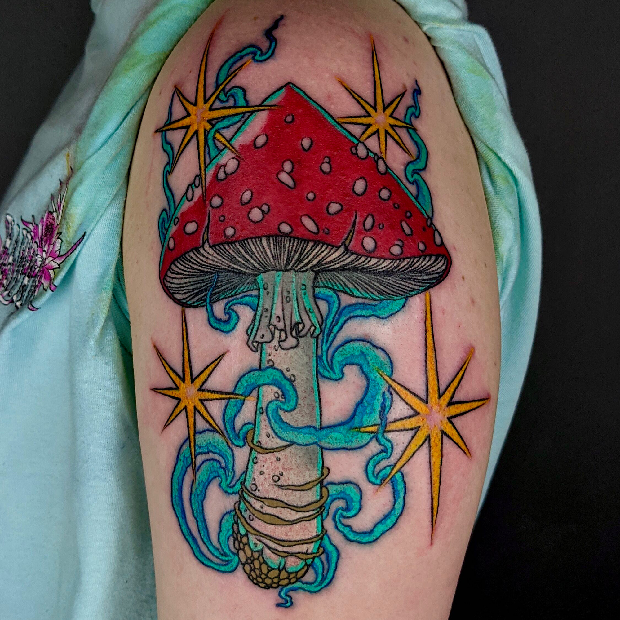Red Magic mushroom smoke and stars neo traditional by ricks custom tattooing Ricardo Pedro