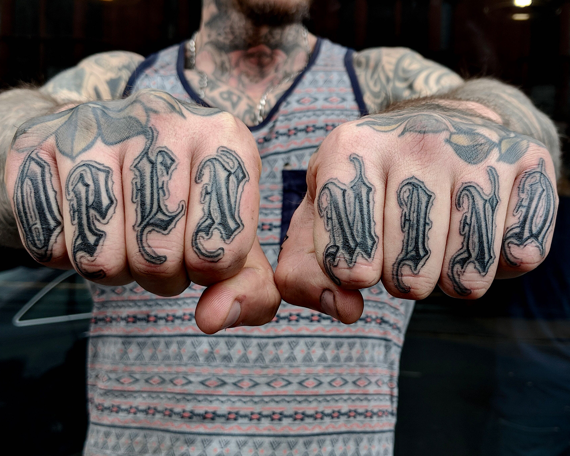 Blackletter Gothic style finger tattoo open mind old english style lettering love letters black and grey gray lettering hand tattoo by Ricks custom tattooing Ricardo Pedro at Nexus Collective