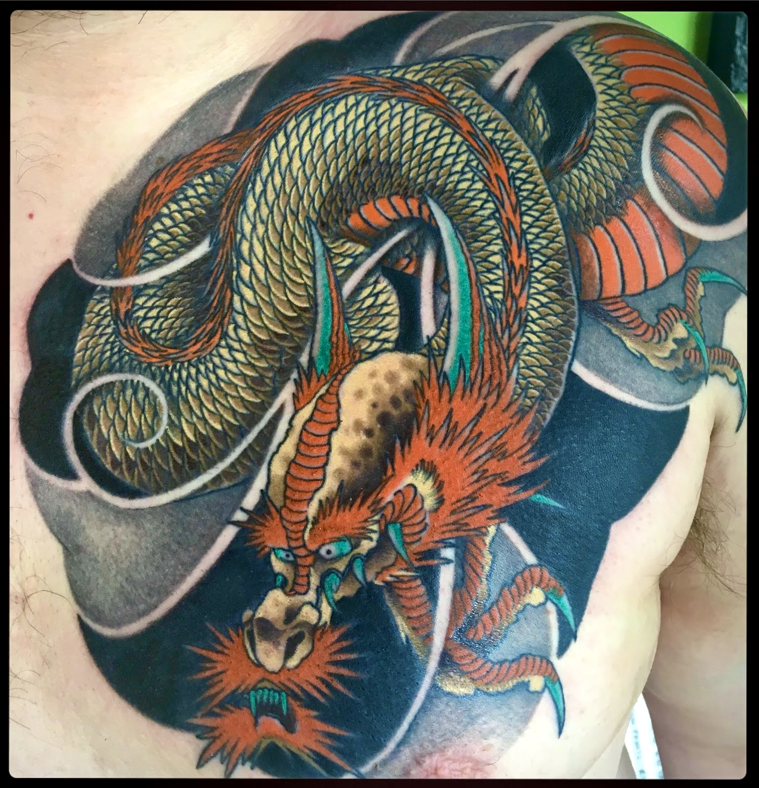 Irezumi neo traditional Japanese oriental tattoo in colour of a dragon ryū chest plate by Ricks custom tattooing Ricardo Pedro at Nexus Collective